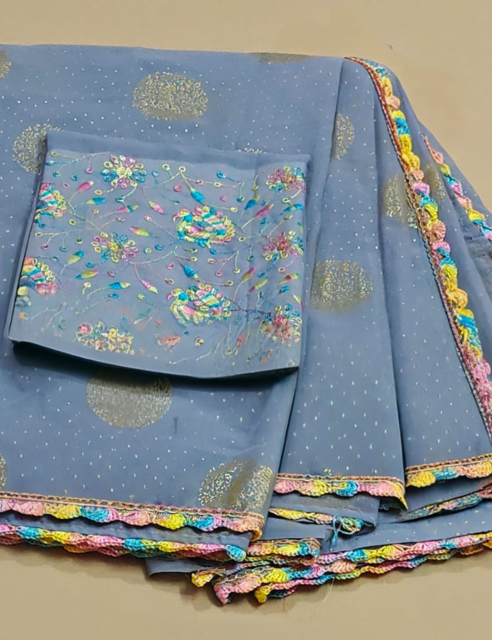 Grey Color Fancy Saree with Elegant Gold Prints & Multicolor Crochet Lace Border