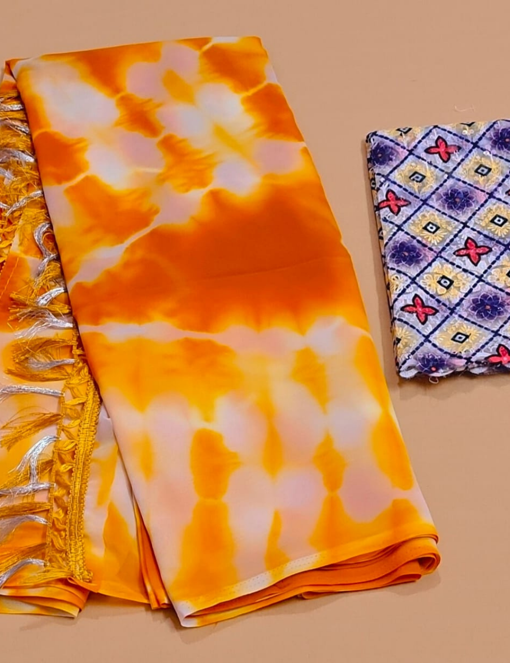 Bright Yellow Tie-Dye Saree with Tassel Border & Printed Blouse