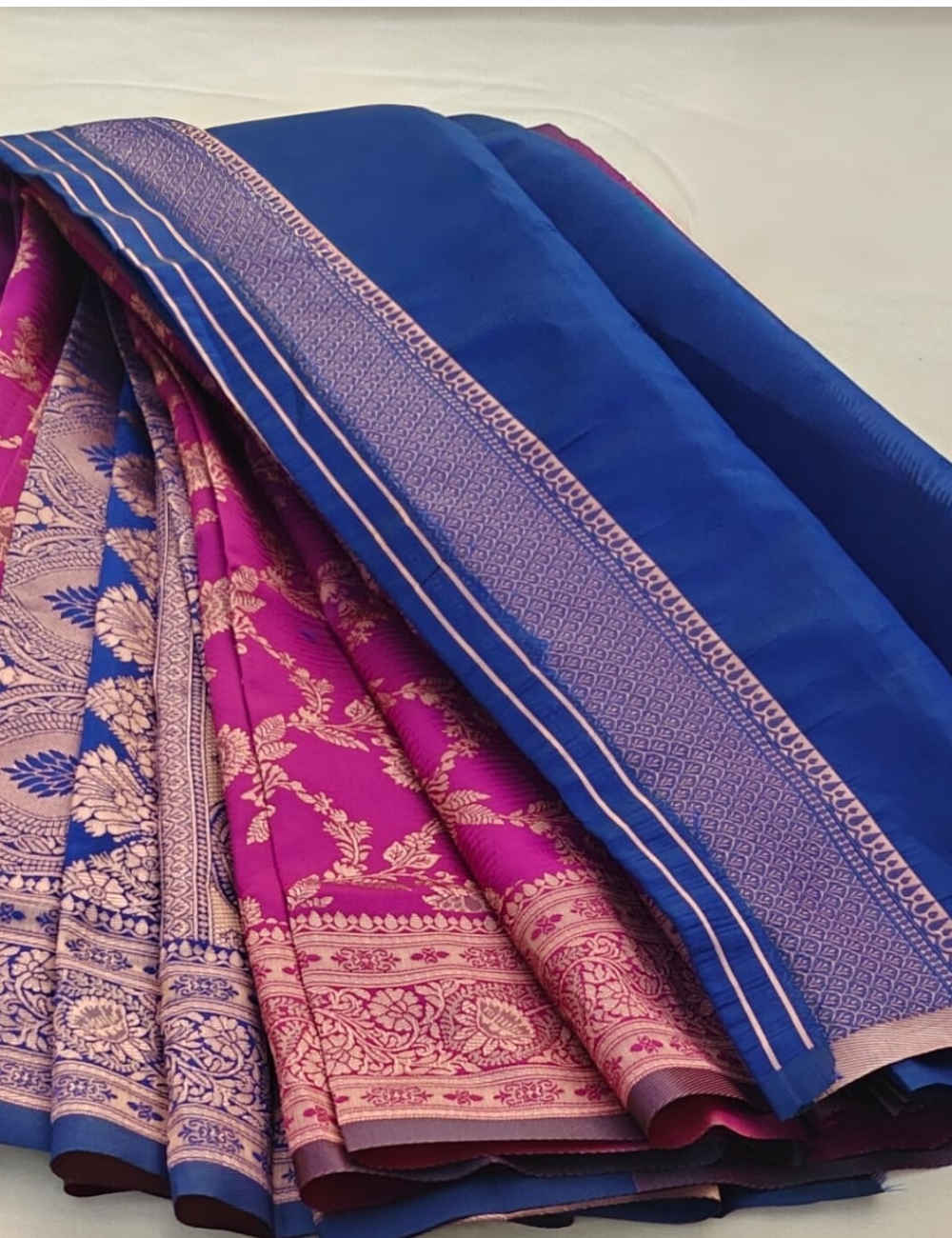 Magenta Silk Blend Saree with Antique Gold Floral Weaving & Royal Blue Contrast Border
