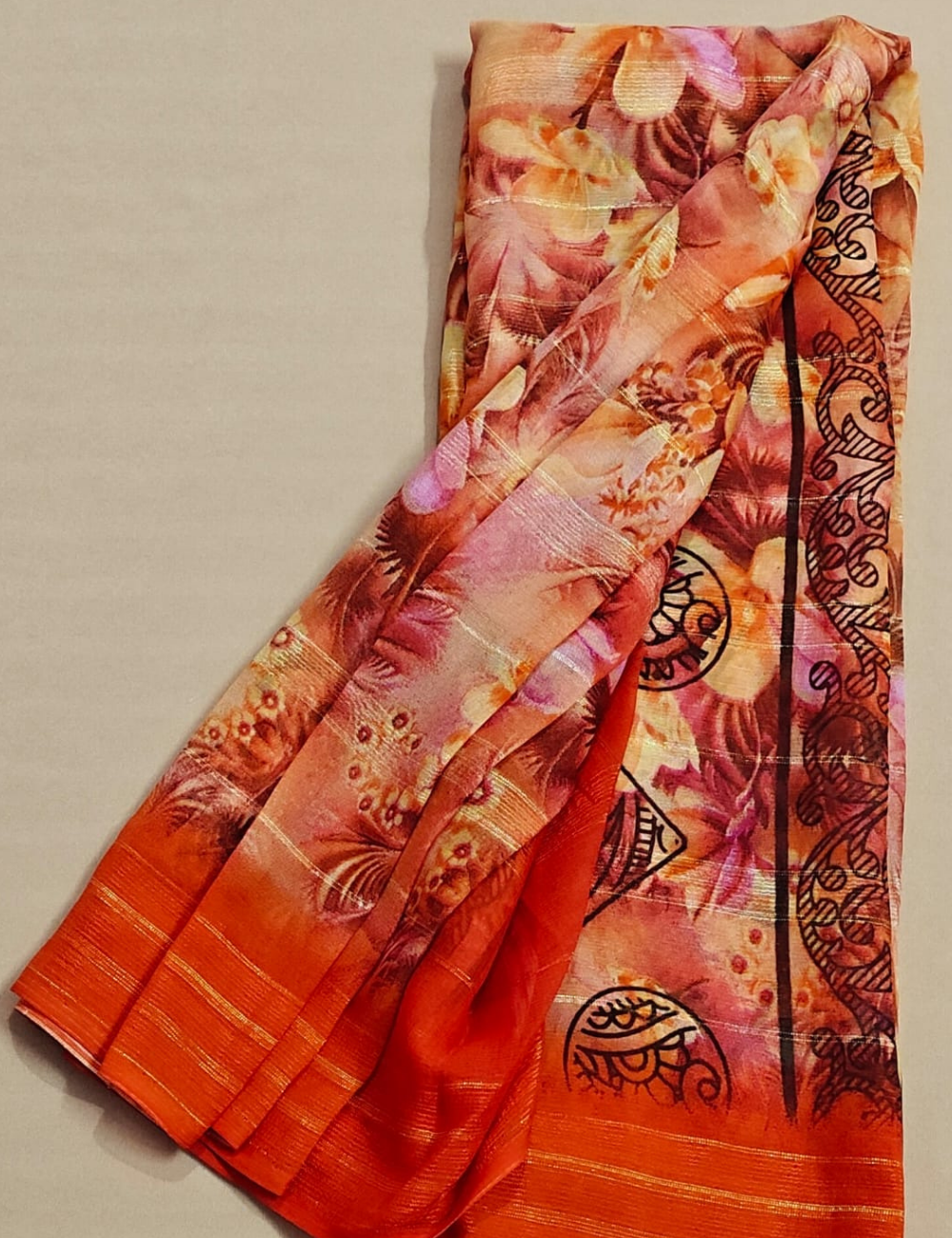 Sunset Orange Floral Georgette Saree with Metallic Stripes & Tribal Accents