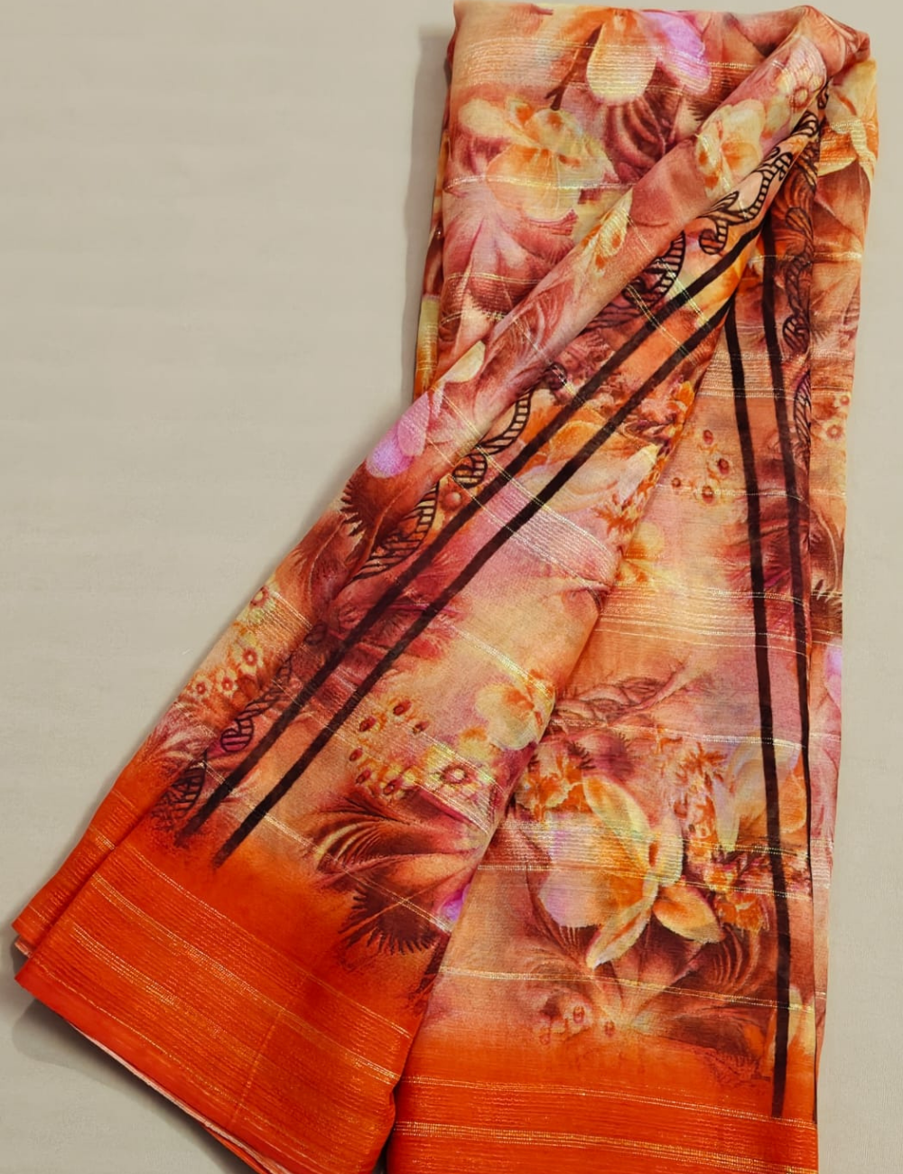 Sunset Orange Floral Georgette Saree with Metallic Stripes & Tribal Accents