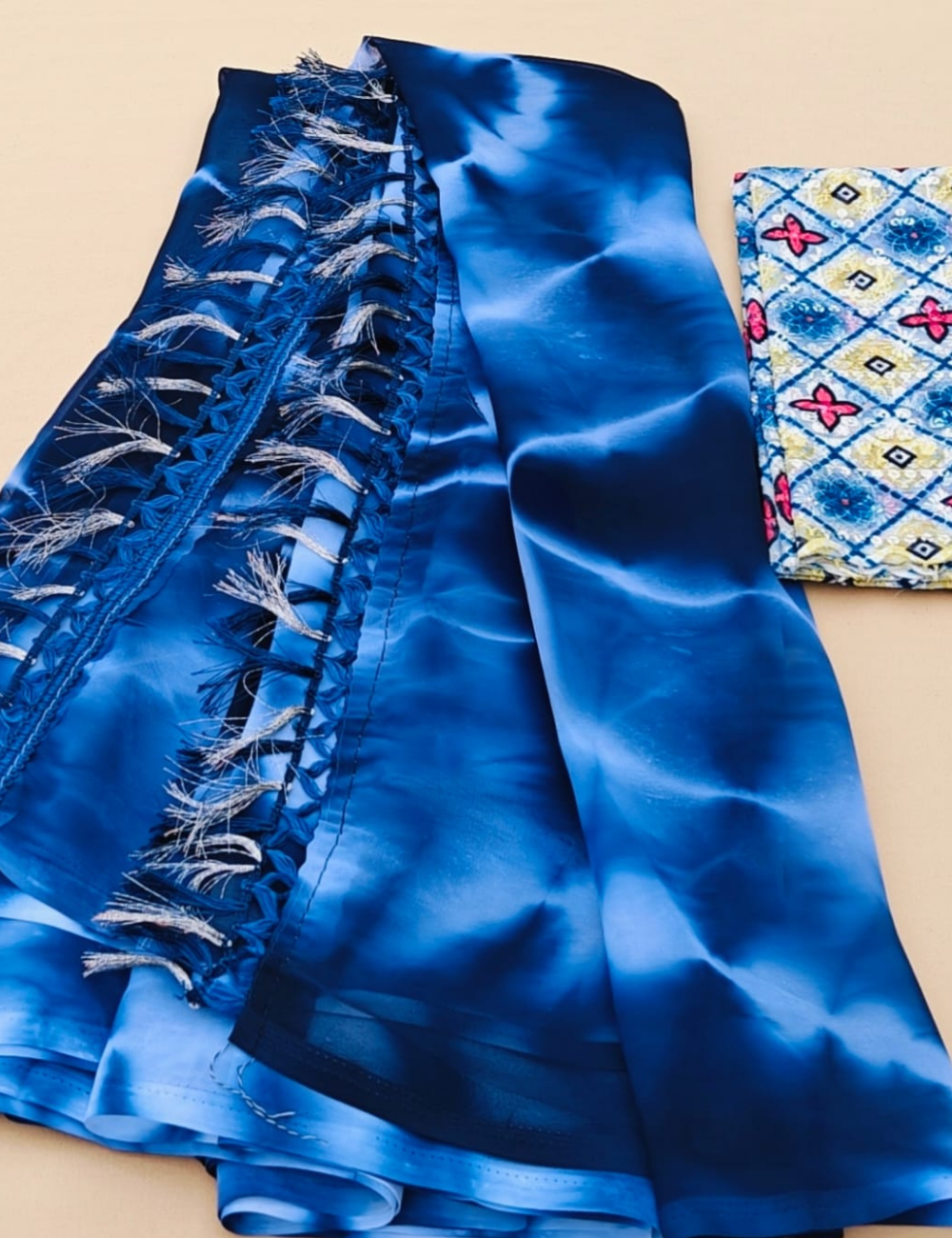 Trendy Tie-Dye Blue Saree with Designer Tassel Border